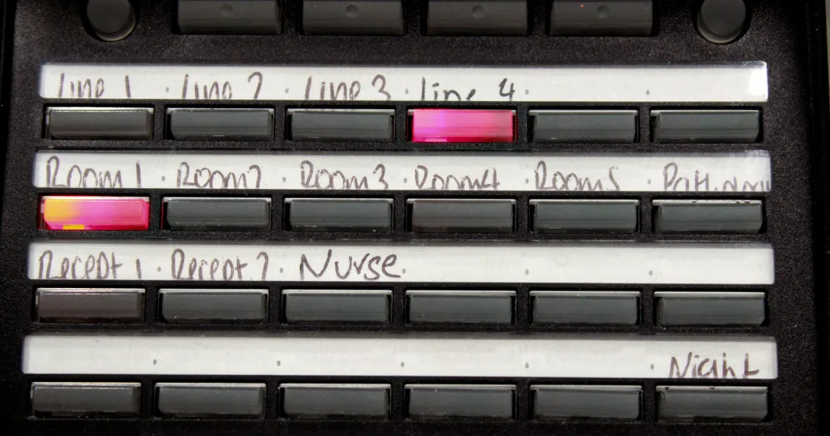 A control panel whose buttons are labelled with handwritten text