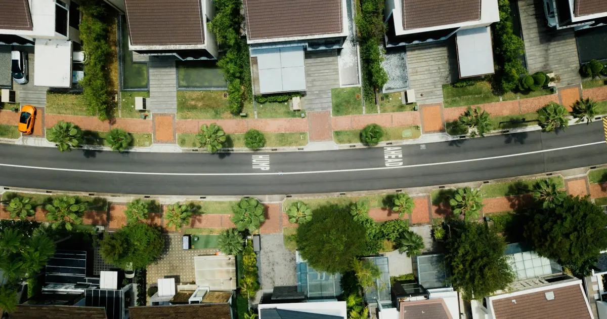 An aerial photo of densely packed houses with brown roofs