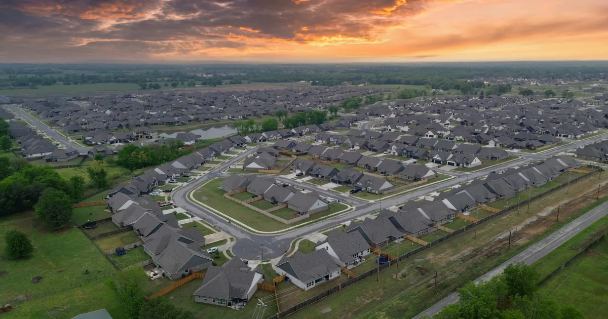 A newly built housing development at the edge of an older neighbourhood